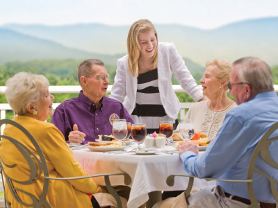 great friends dining outside at a senior living community in Daleville, Va.