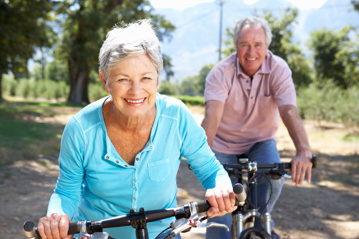 senior couple enjoying a bike ride together