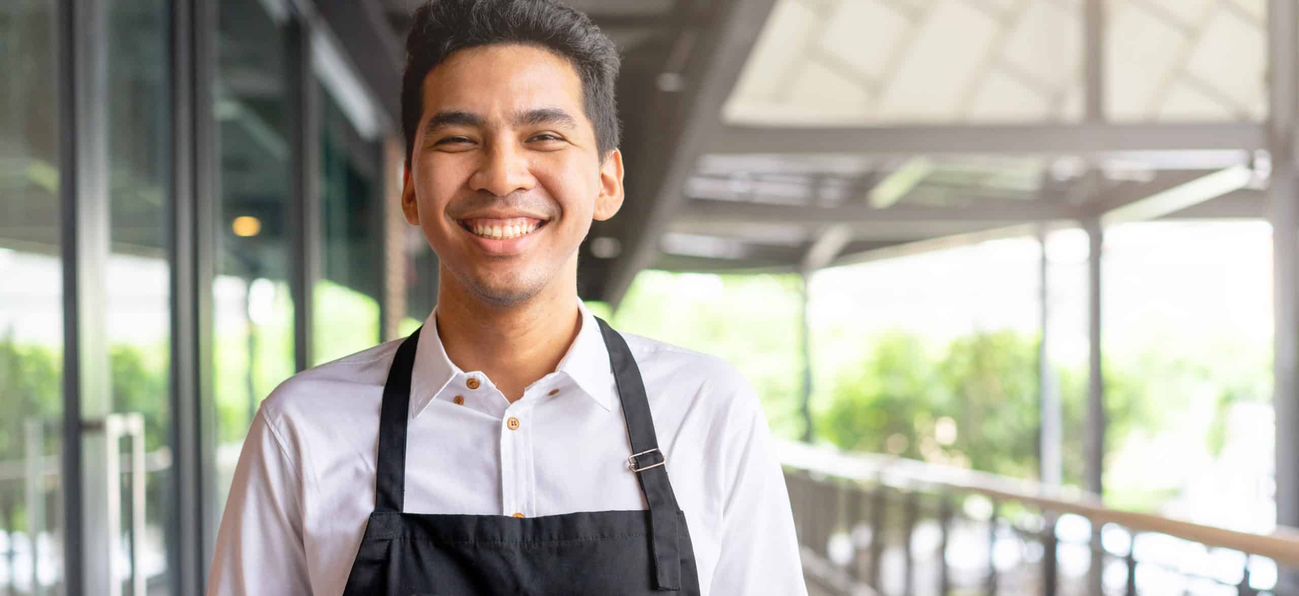 senior community employee smiling