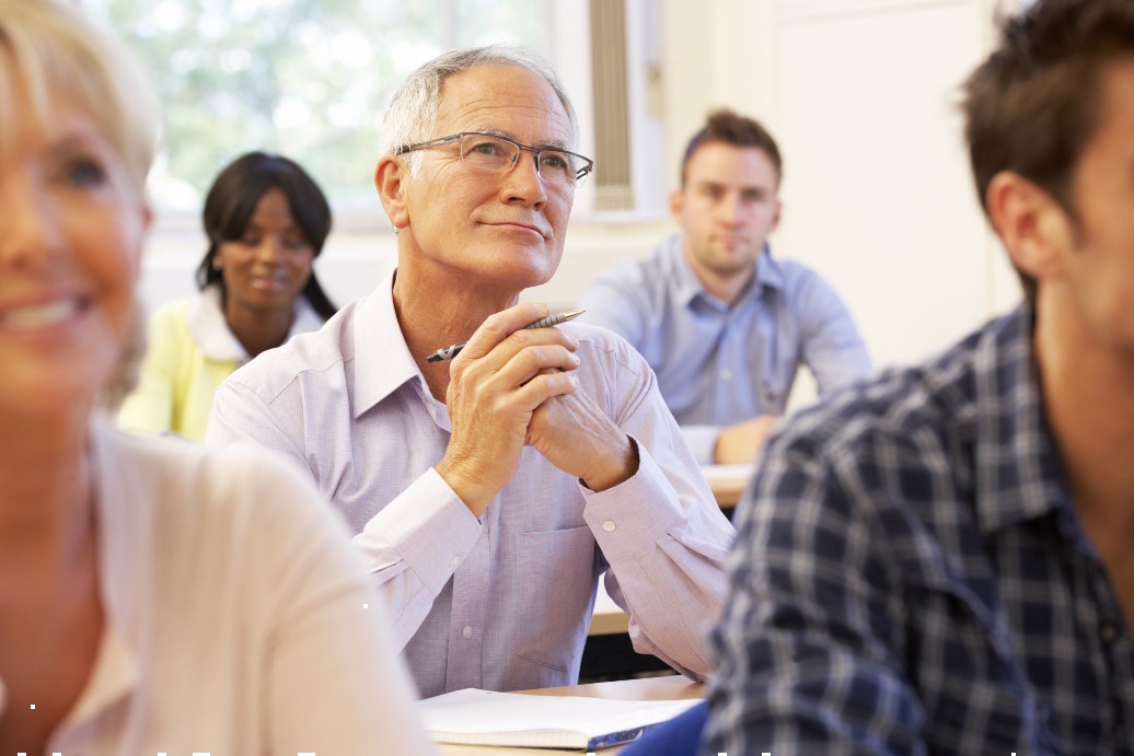 senior man in a class learning something new while in retirement