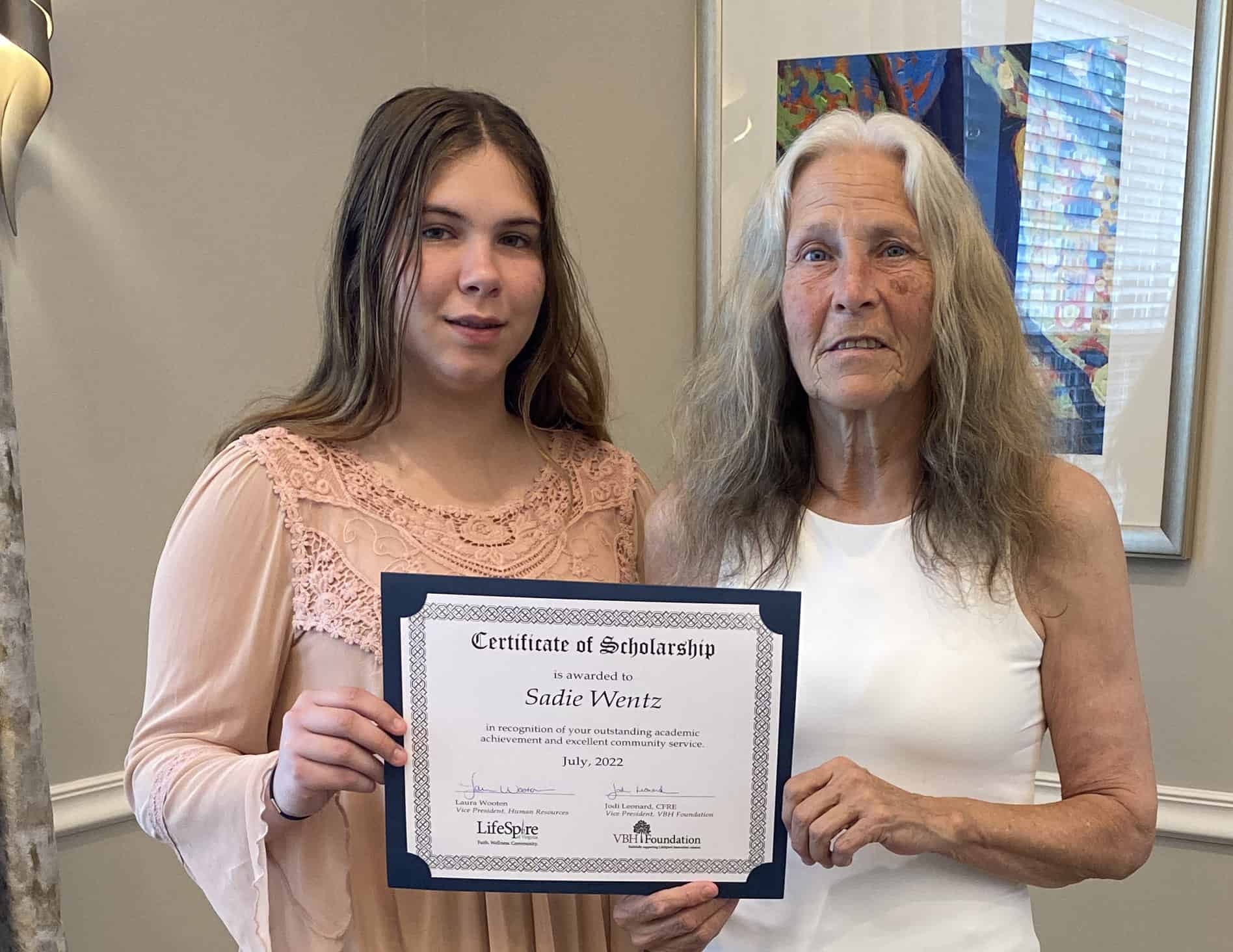 Young professionals receiving scholarship