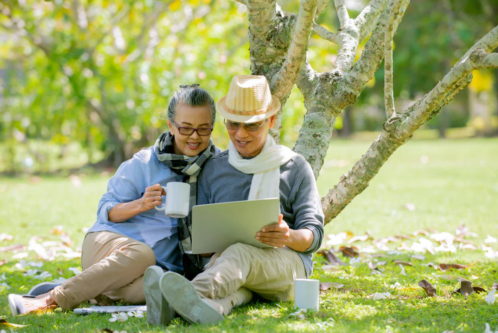 Senior couple retirement planning and relaxing in the park
