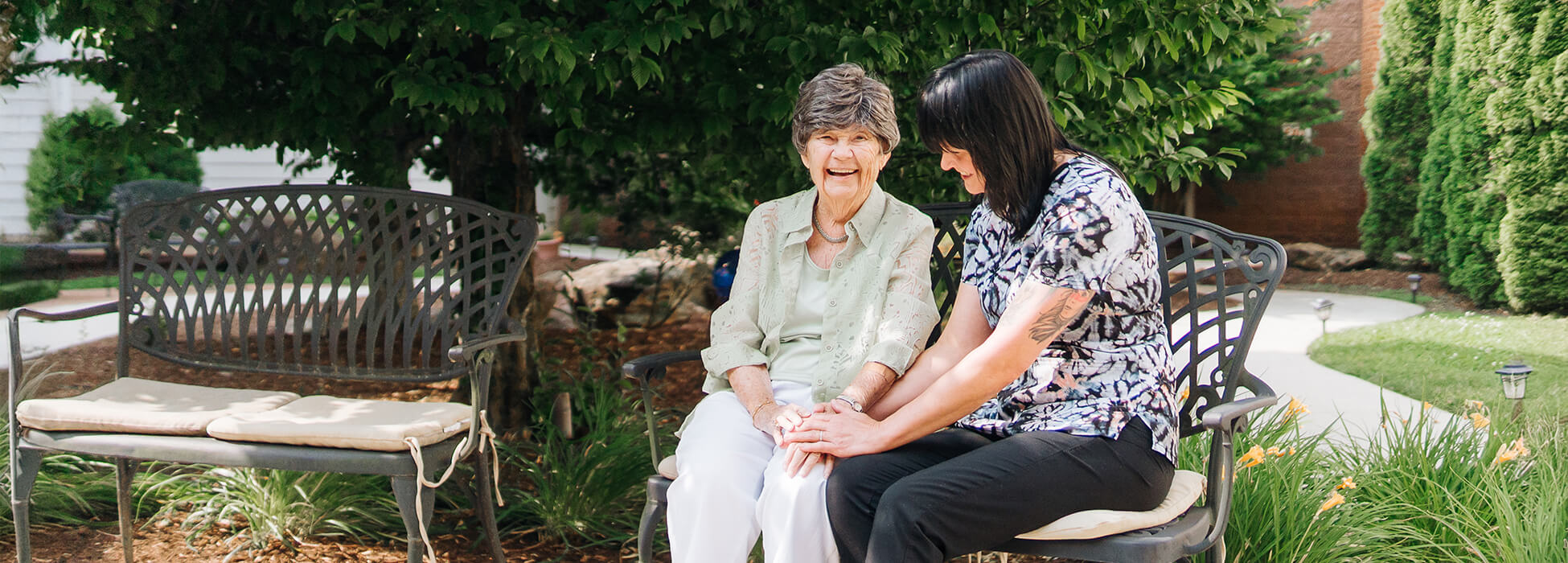 Employee talking to senior woman outdoors