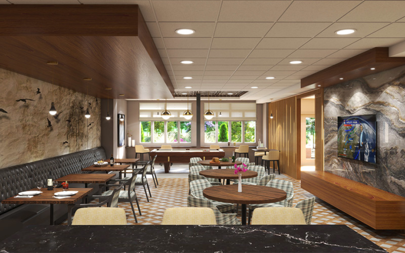 Spacious lounge area with seating and large windows in a senior living community.