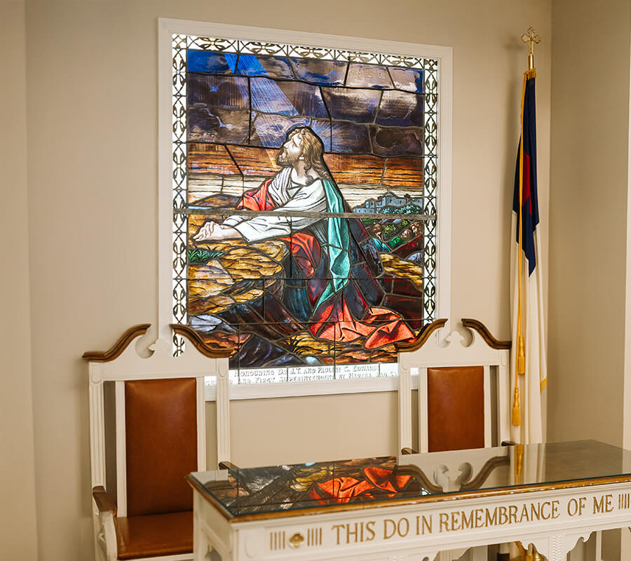Stained glass depicting Jesus in assembly room