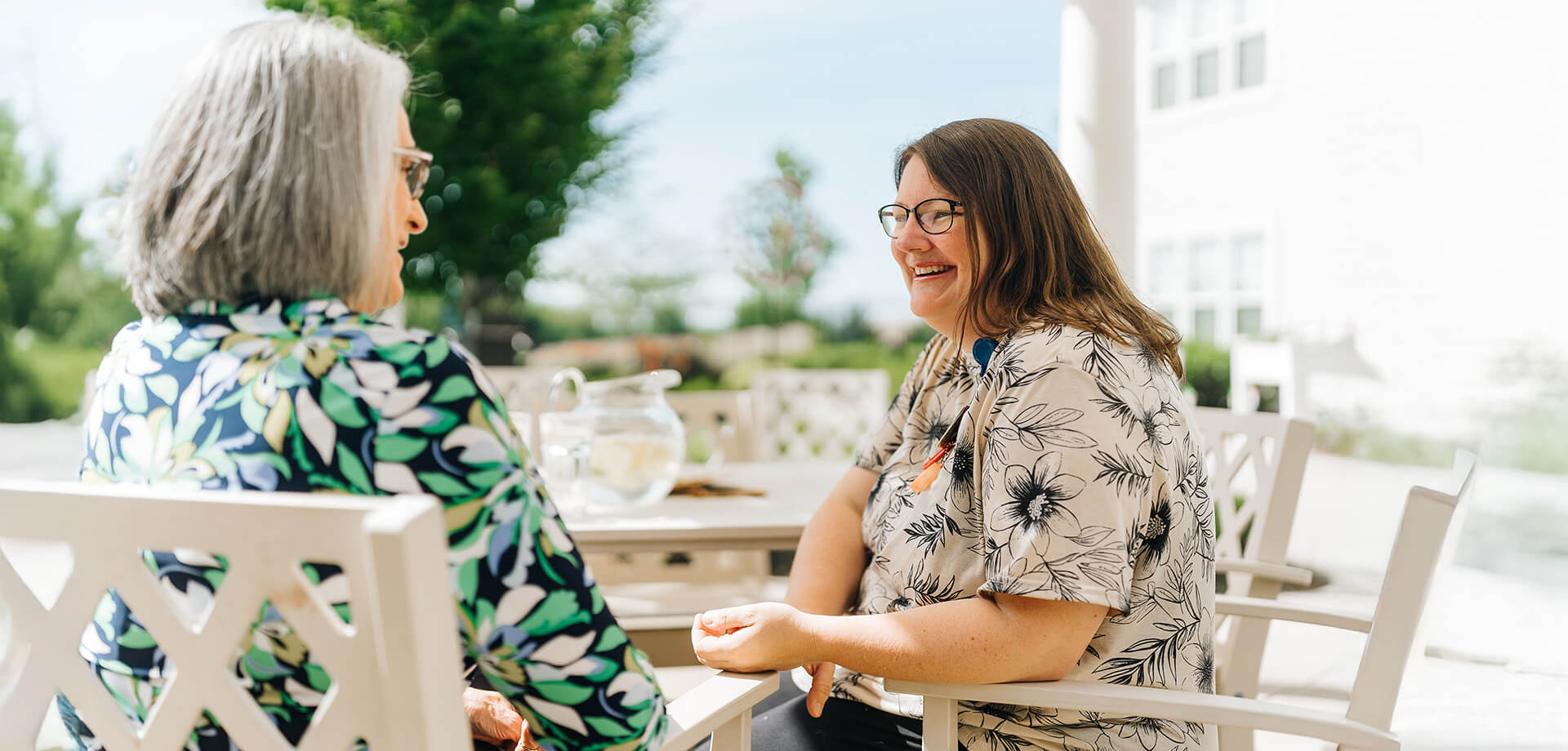 Culpeper resident sits with caregiver on porch