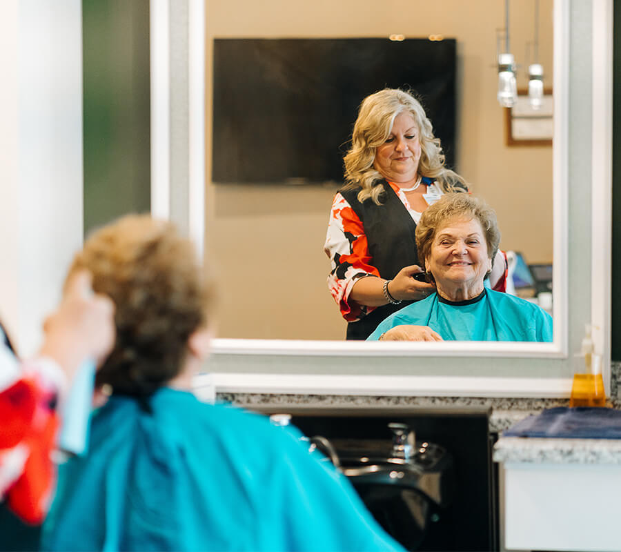 Senior resident receiving haircut at the Culpeper