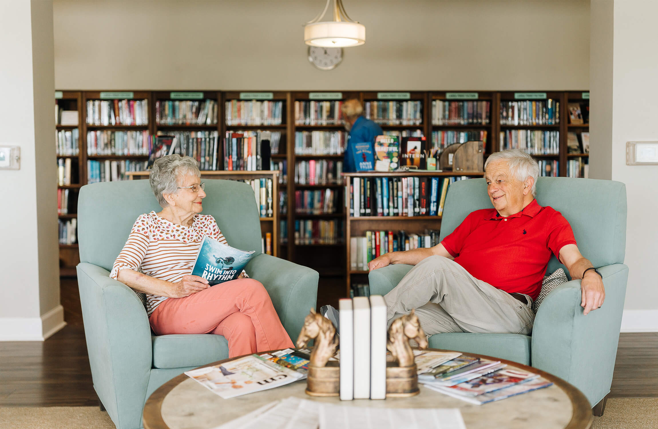 Culpeper senior residents talking in library chairs