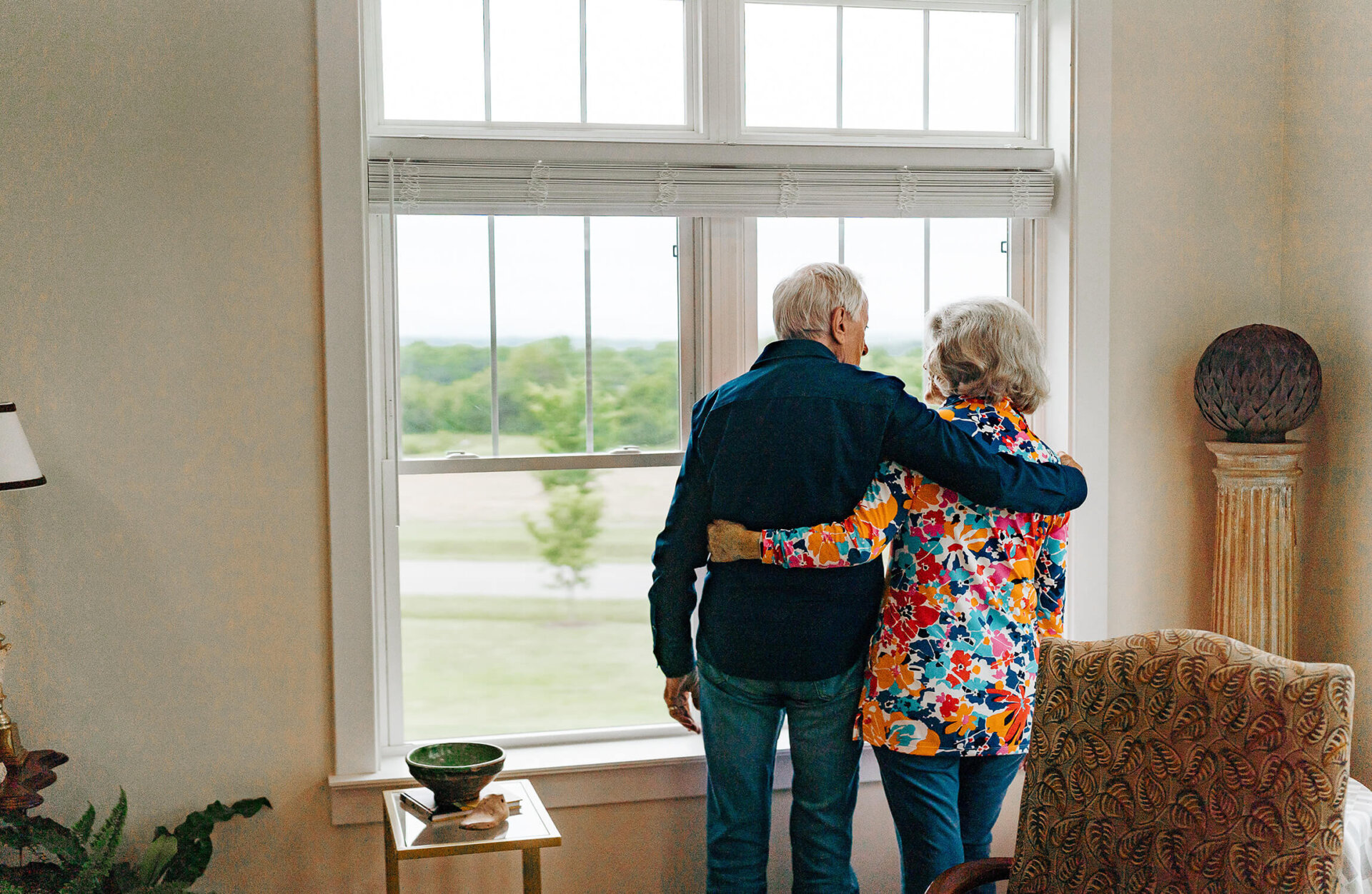 Culpeper couple looking out window in home