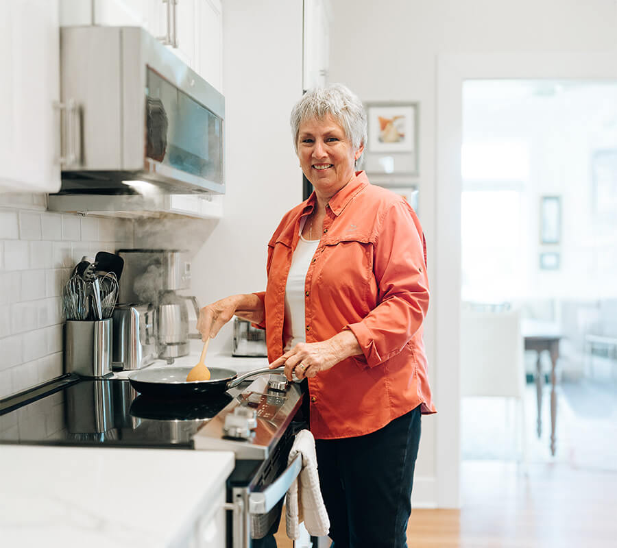 Senior woman cooking in kitchen