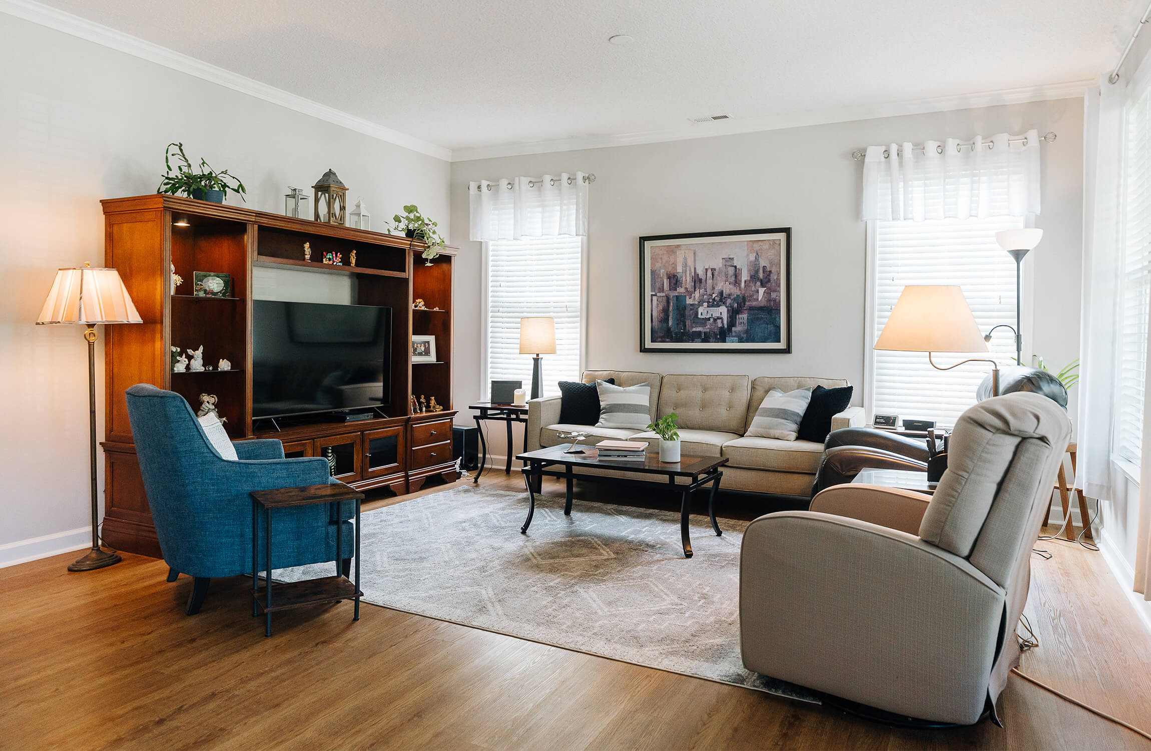 Inviting Living Space with Cozy Seating Bright, inviting living space with cozy seating and natural light.