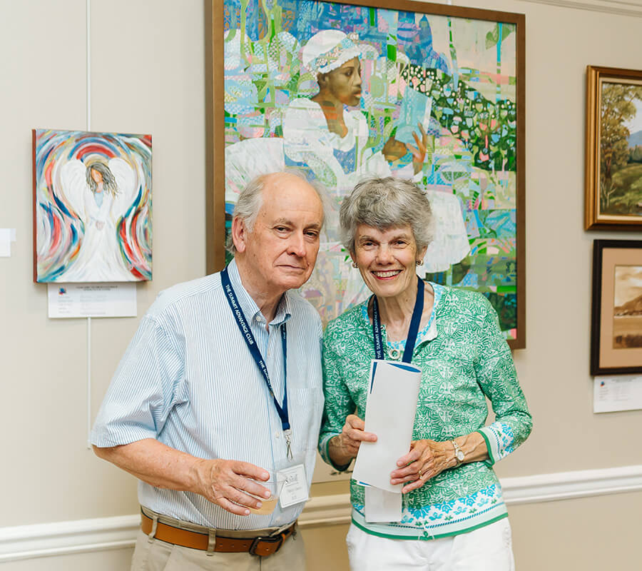 Senior couple smiling in an art gallery