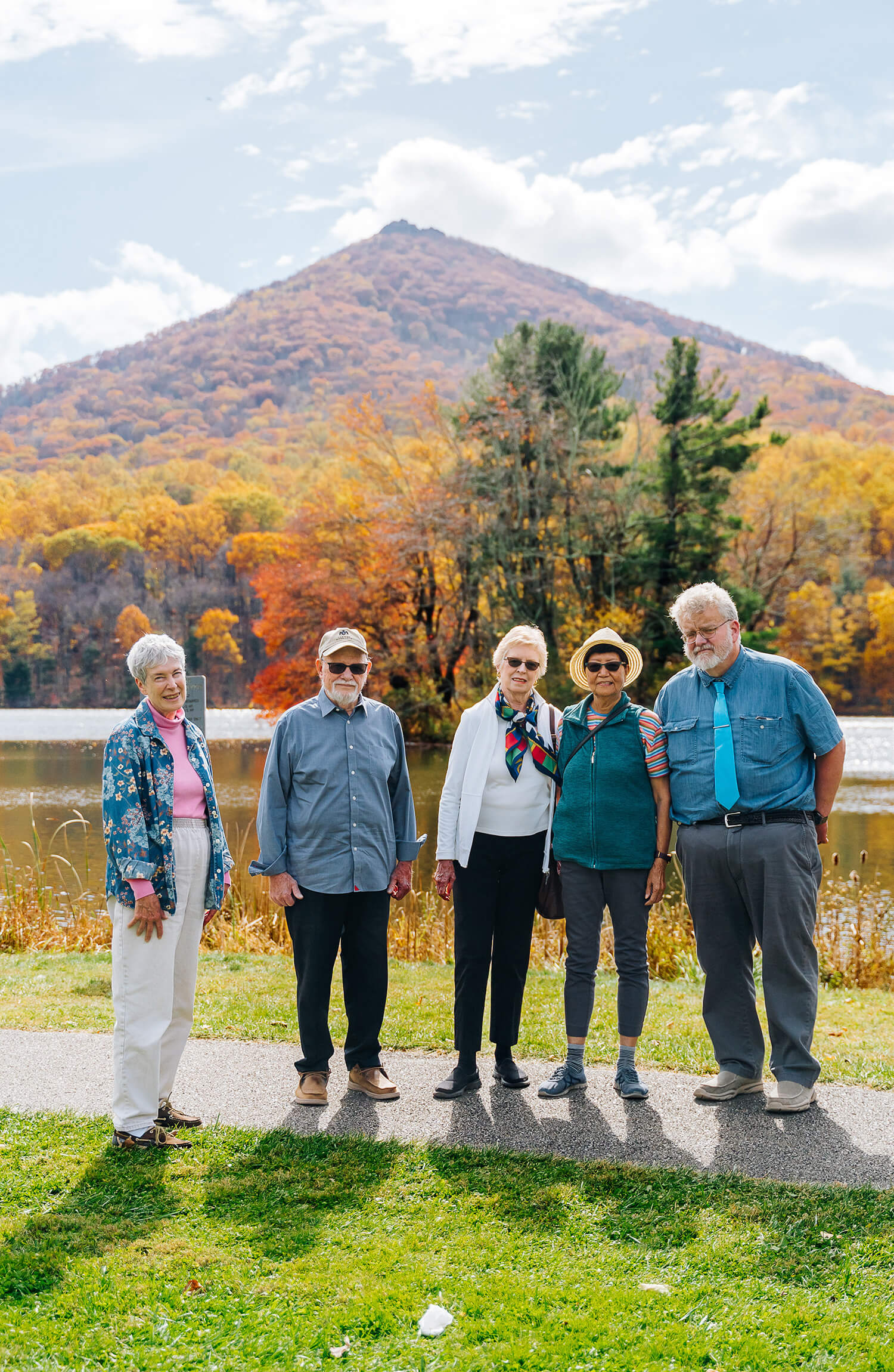 Senior friends standing with a mountain view in the background