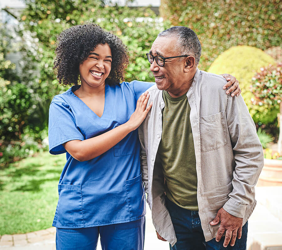 Senior man walks with nurse