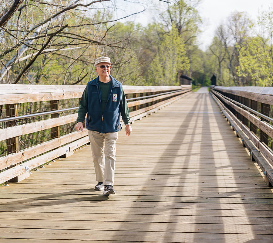 Summit resident walking on a path