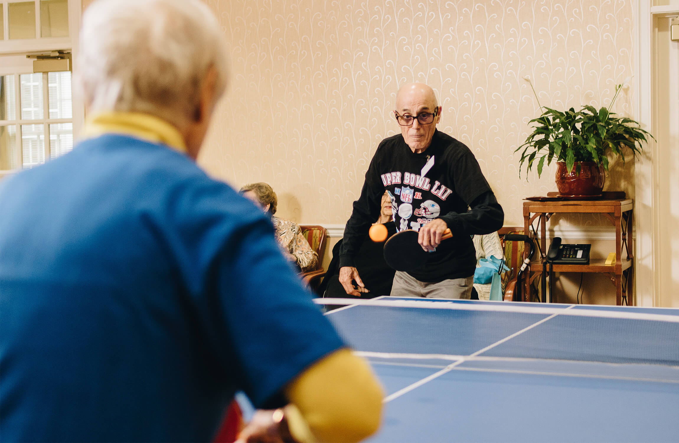 Senior men playing ping pong