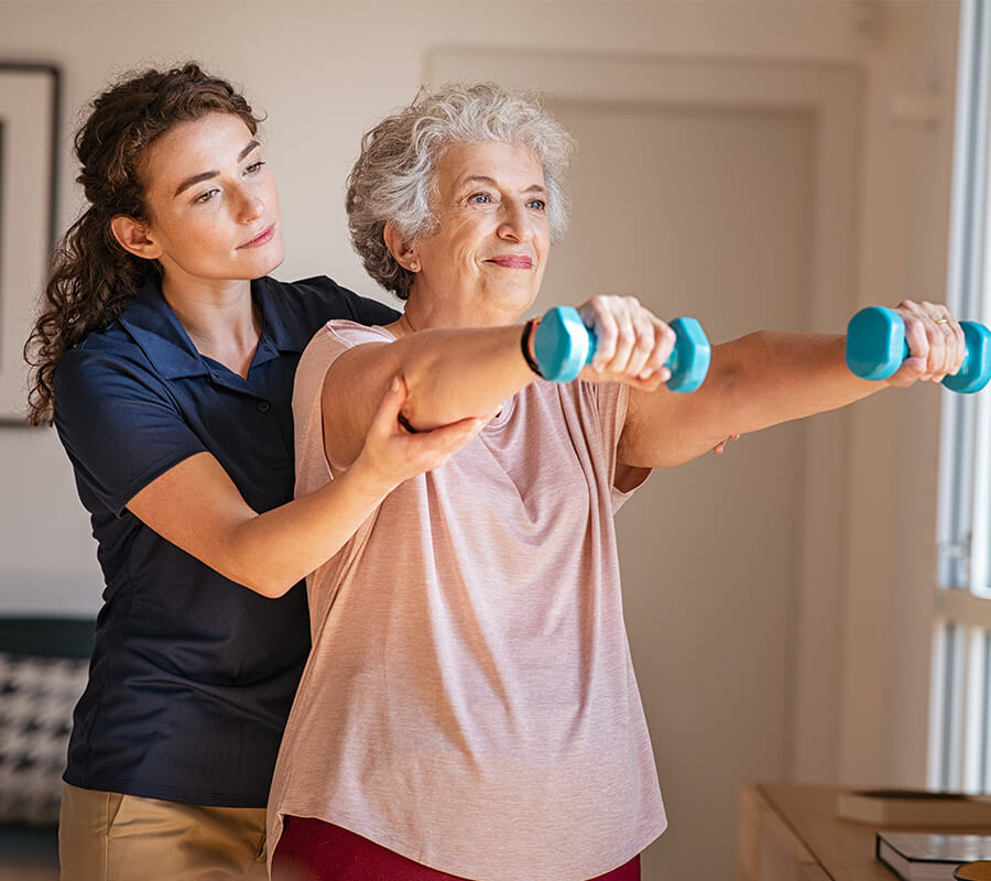 Senior woman gets assistance from therapist