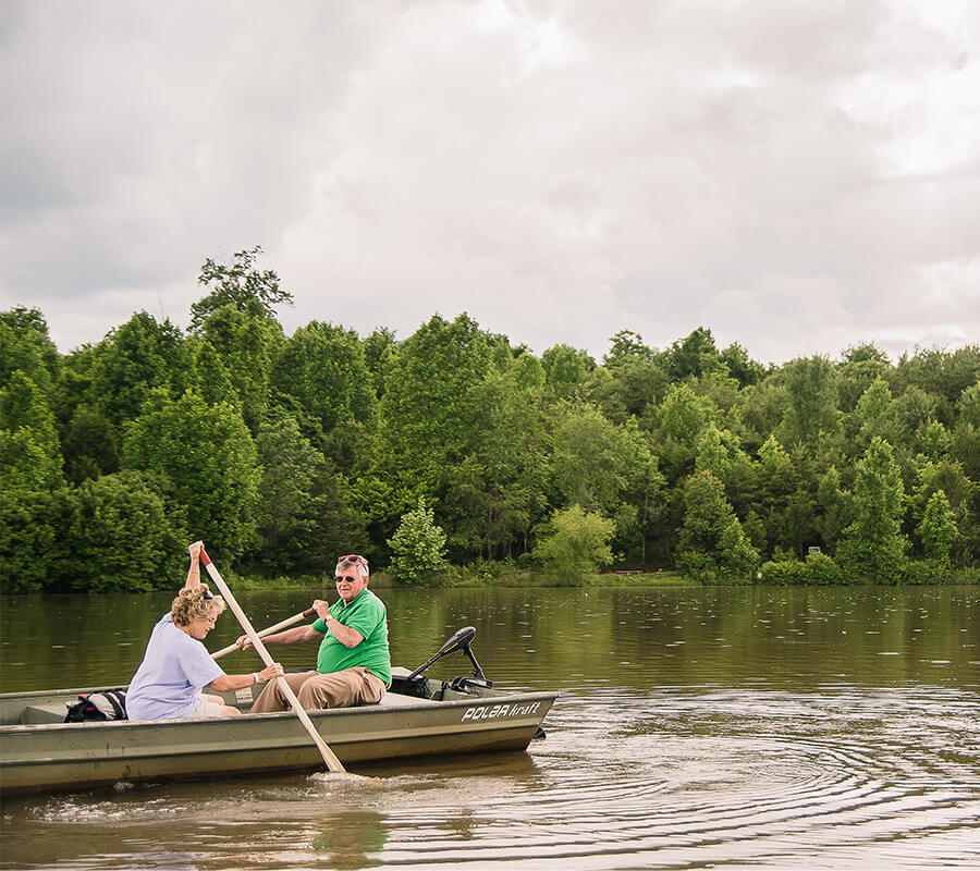 seniors-boating-on-lake Senior couple boating on a lake