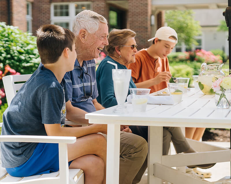 seniors dining with grandkids