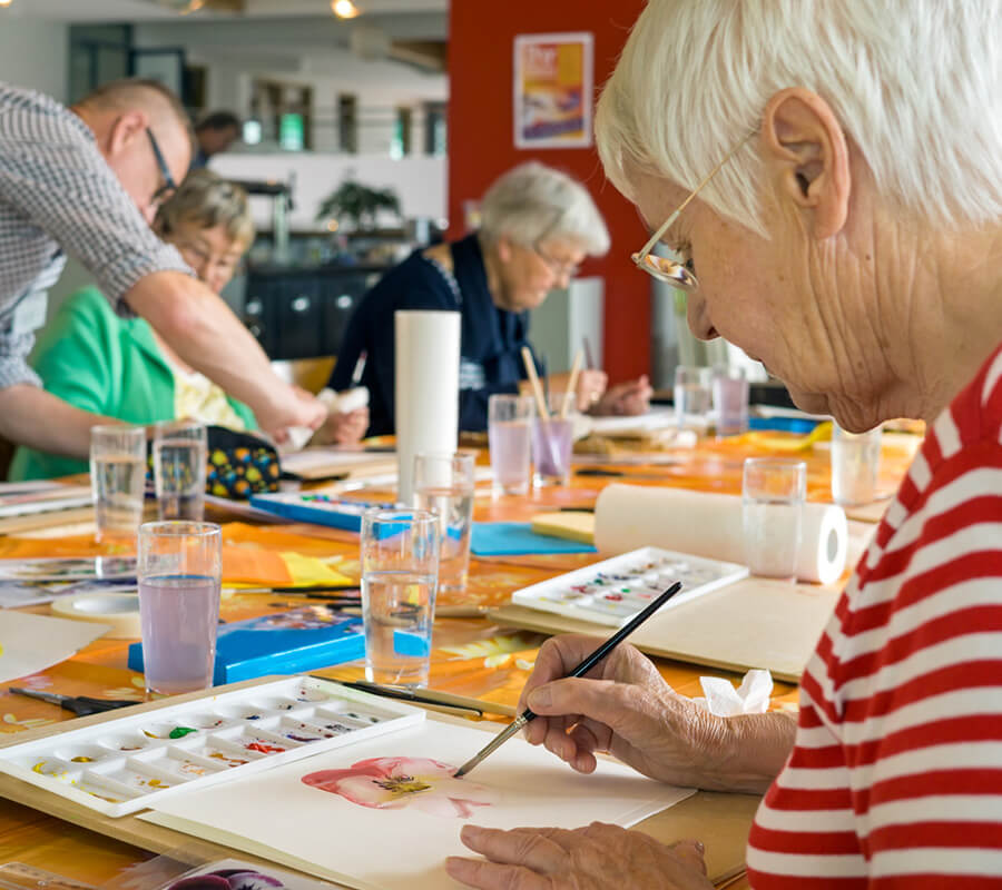 Senior woman in painting class