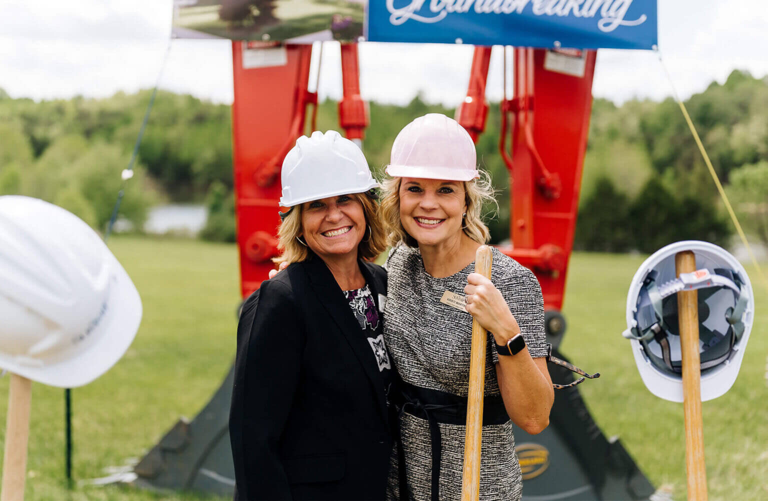 Summit leadership smile with shovel during groundbreaking ceremony