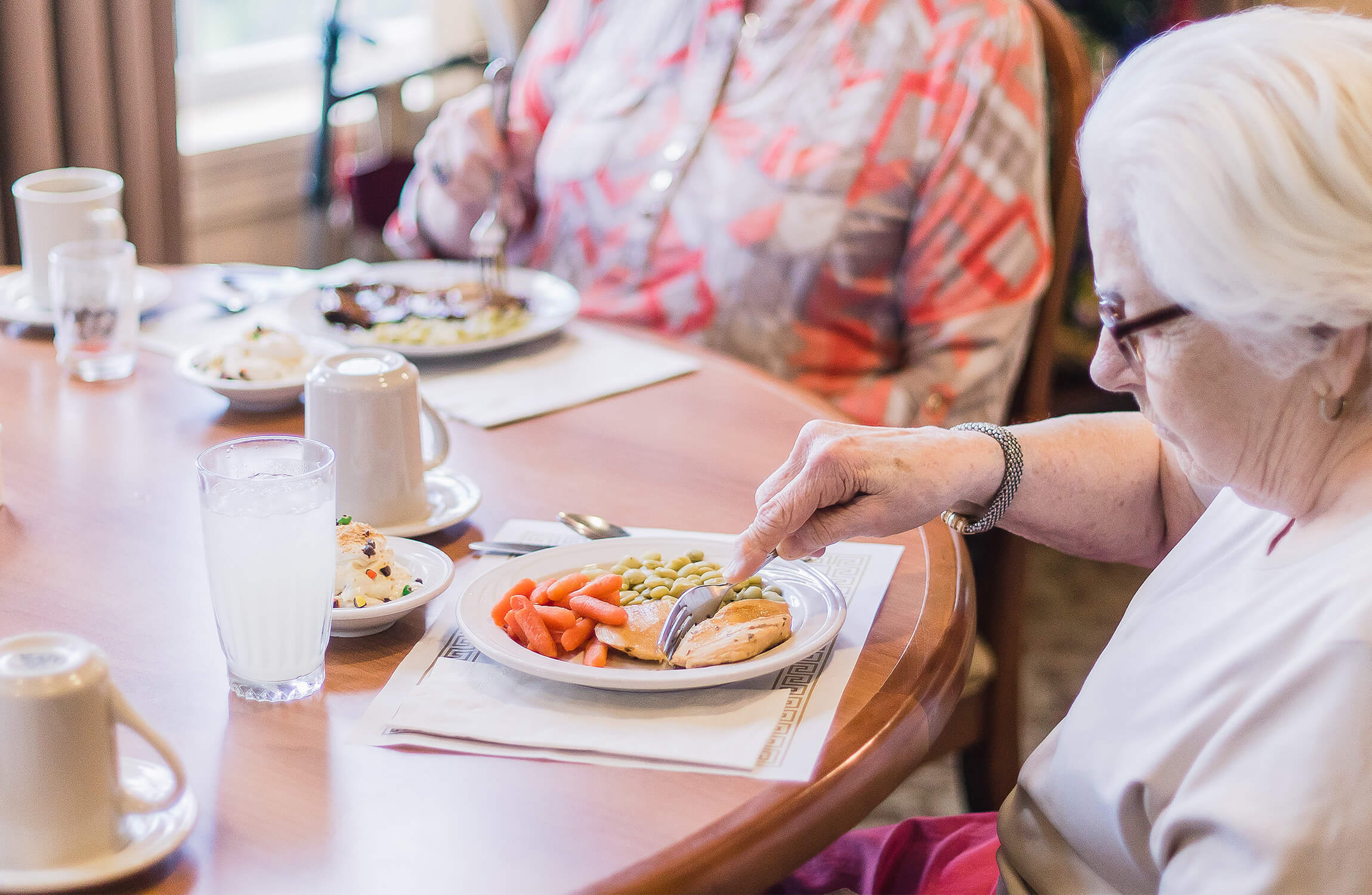 Senior woman enjoying dinner