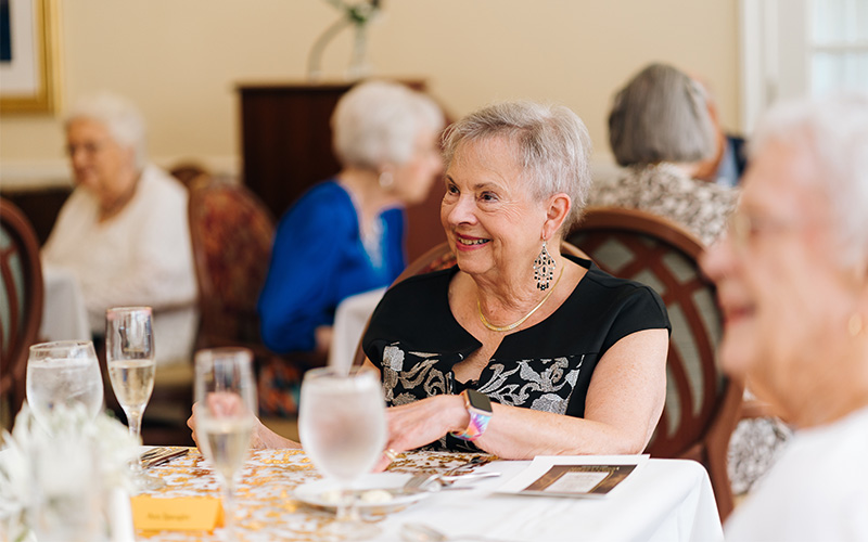 The Summit resident enjoying a meal with good company