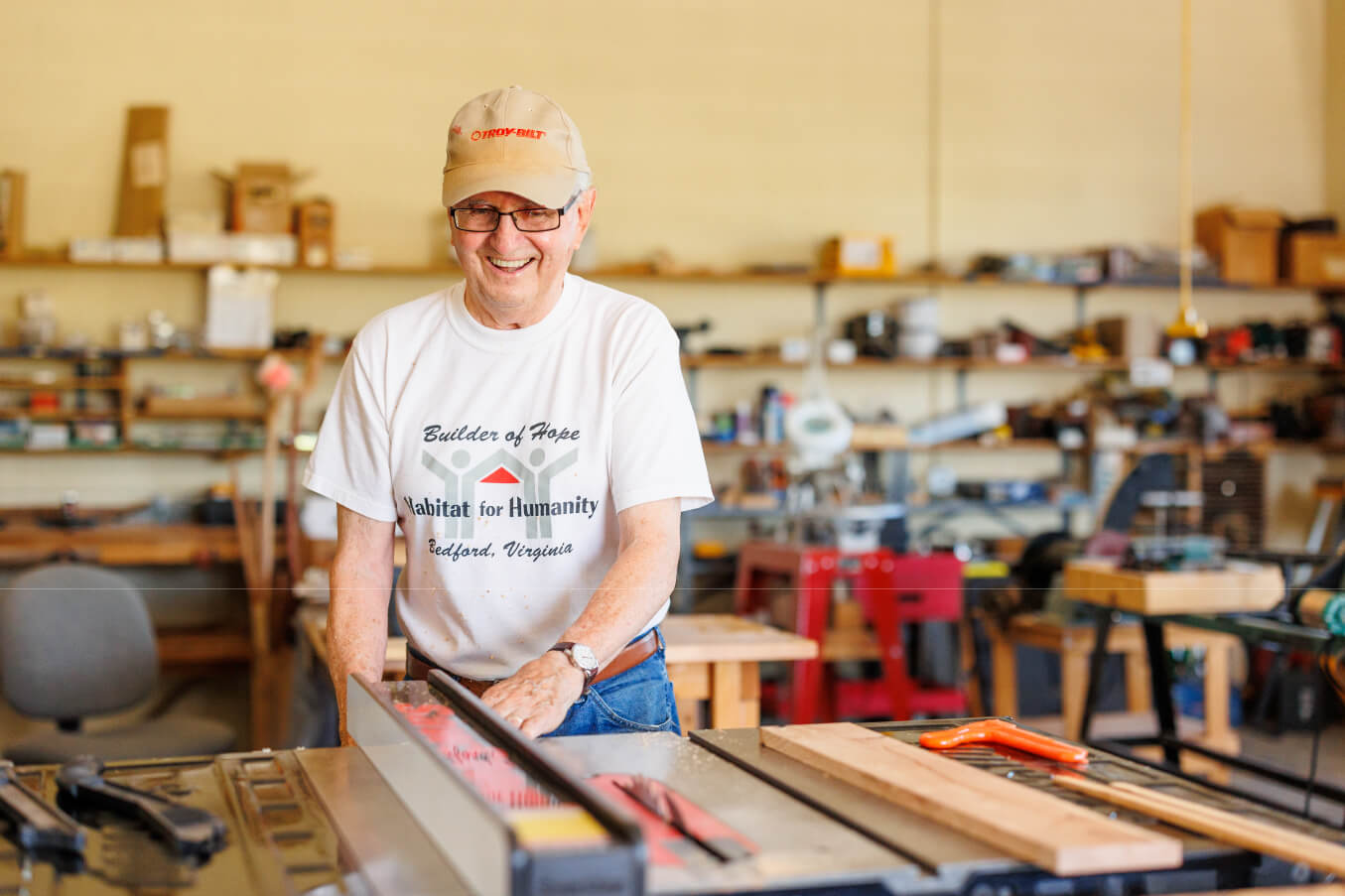 woodworking (1) Man using woodshop and smiling