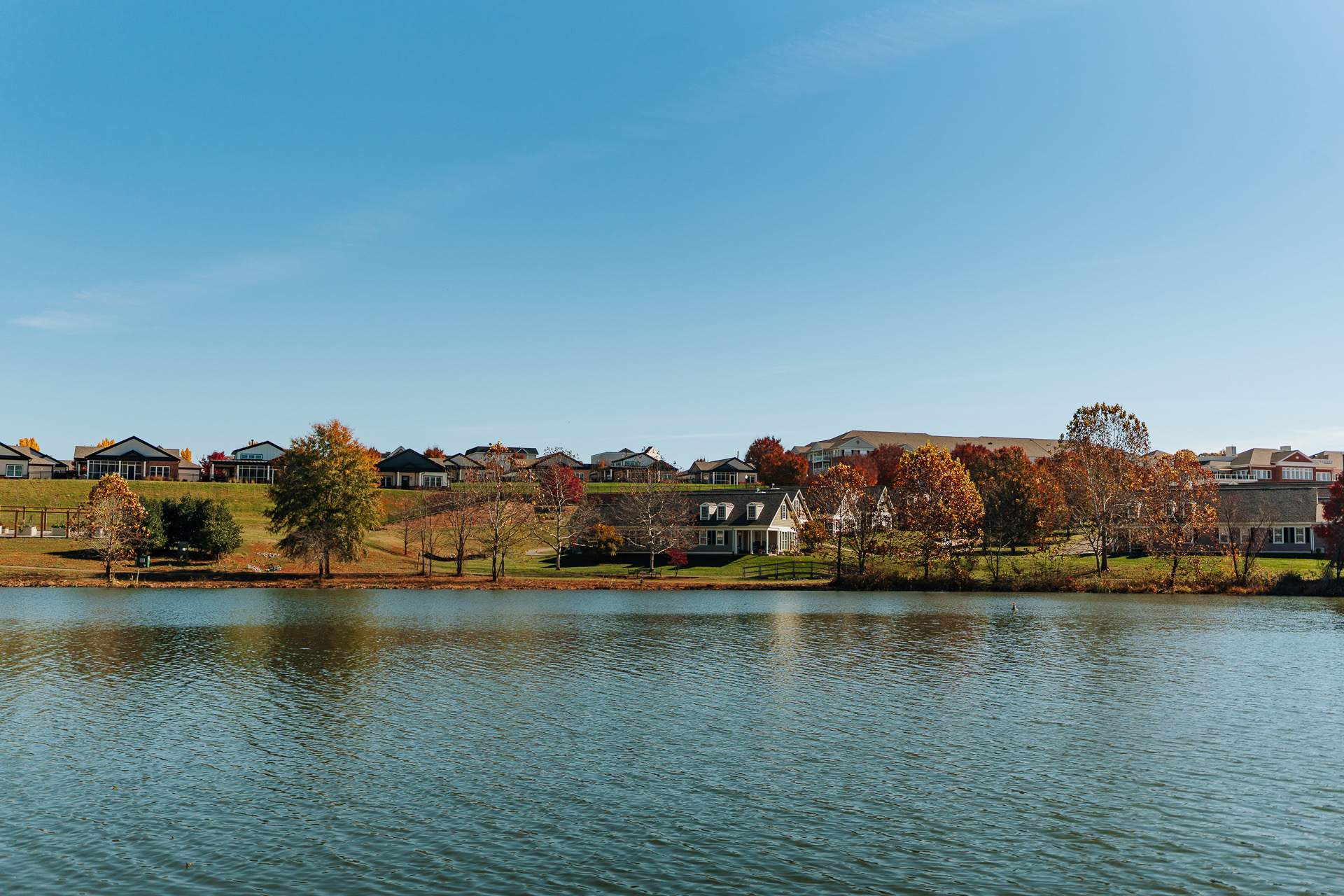 view of senior living community neighborhood from lake