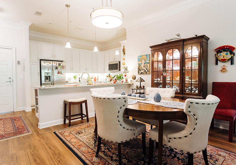Cozy living unit with stylish dining area and modern kitchen in a bright setting.