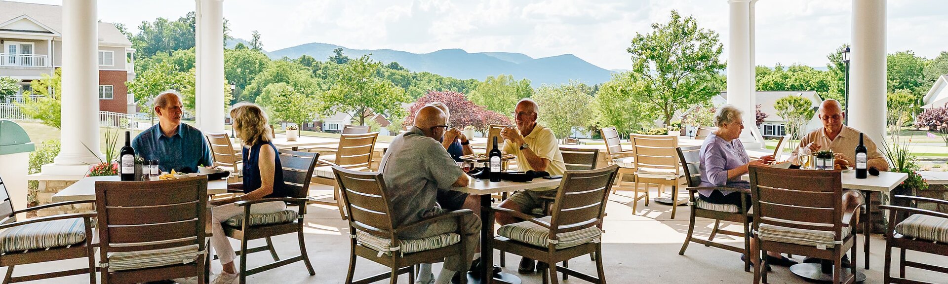 Residents of The Glebe dining on outdoor patio
