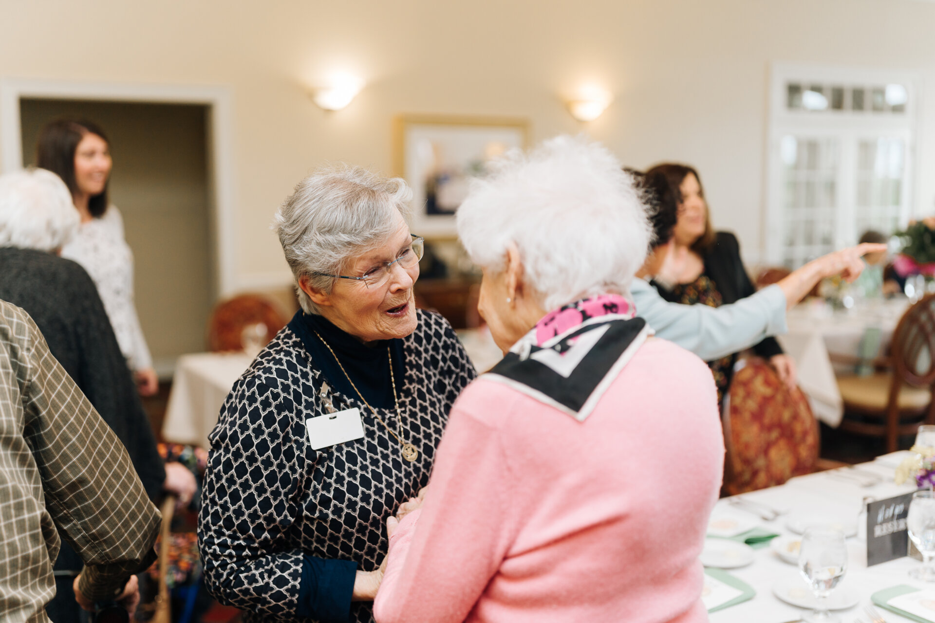 Women talking at an event