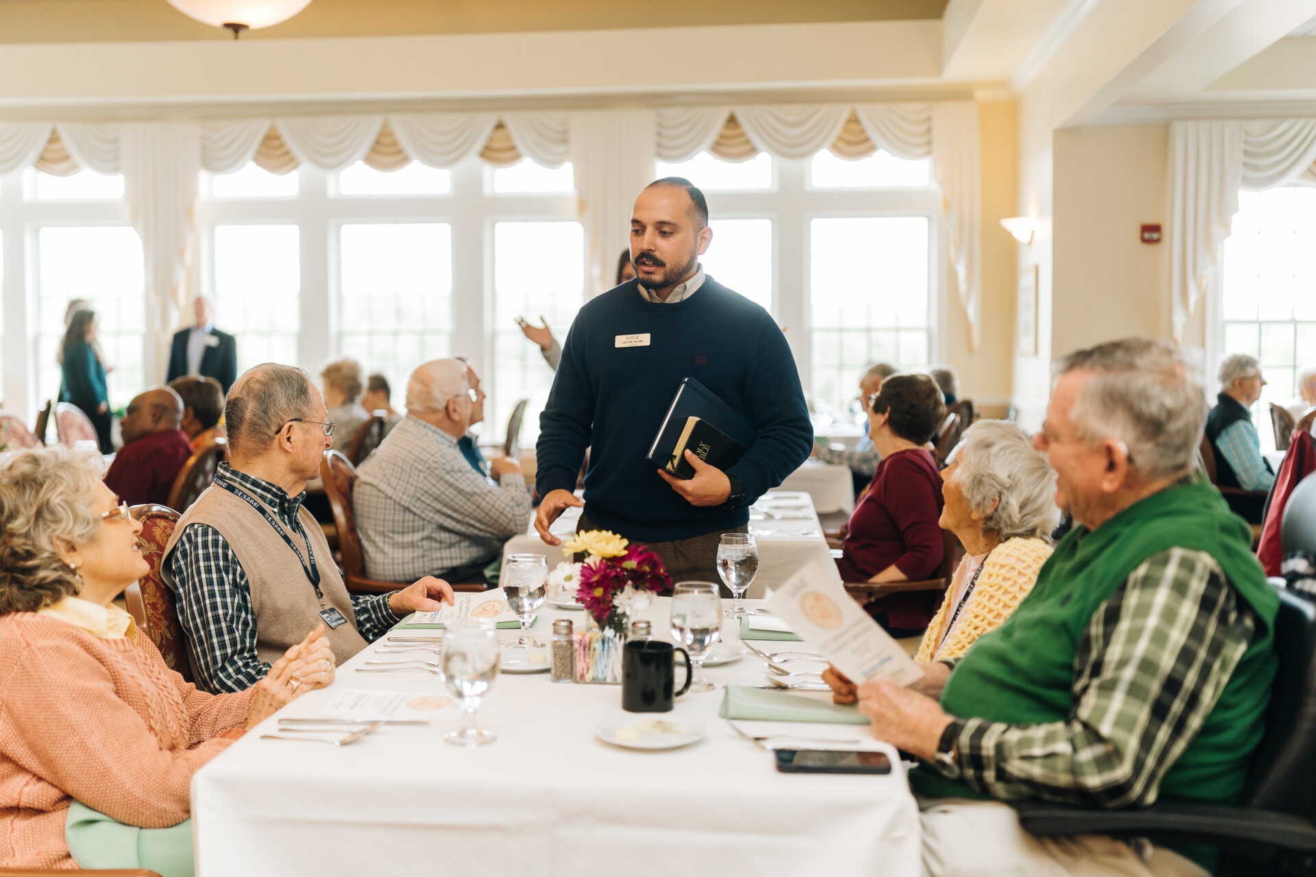 Waiter taking a group's order