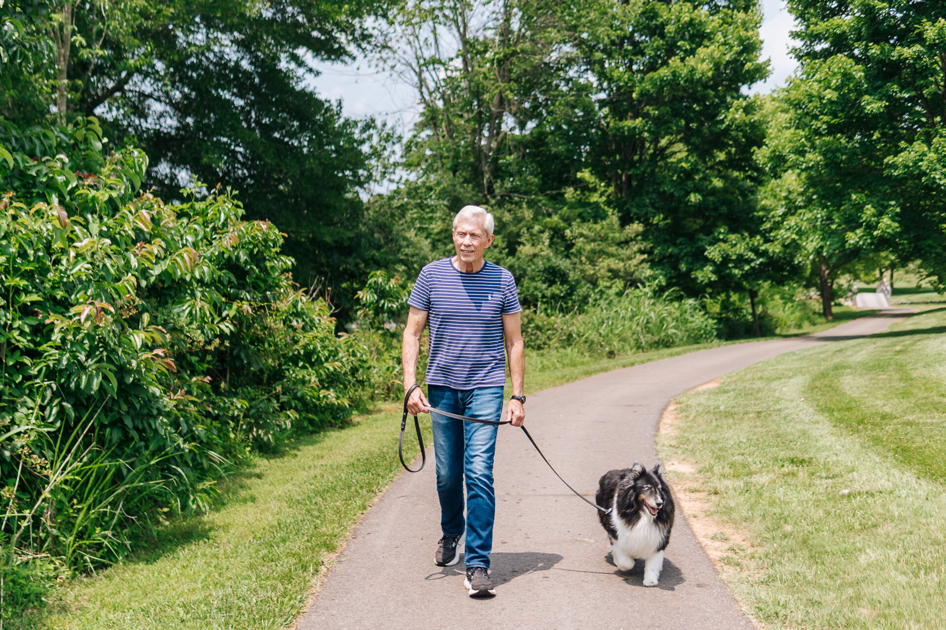Senior man walking his dog