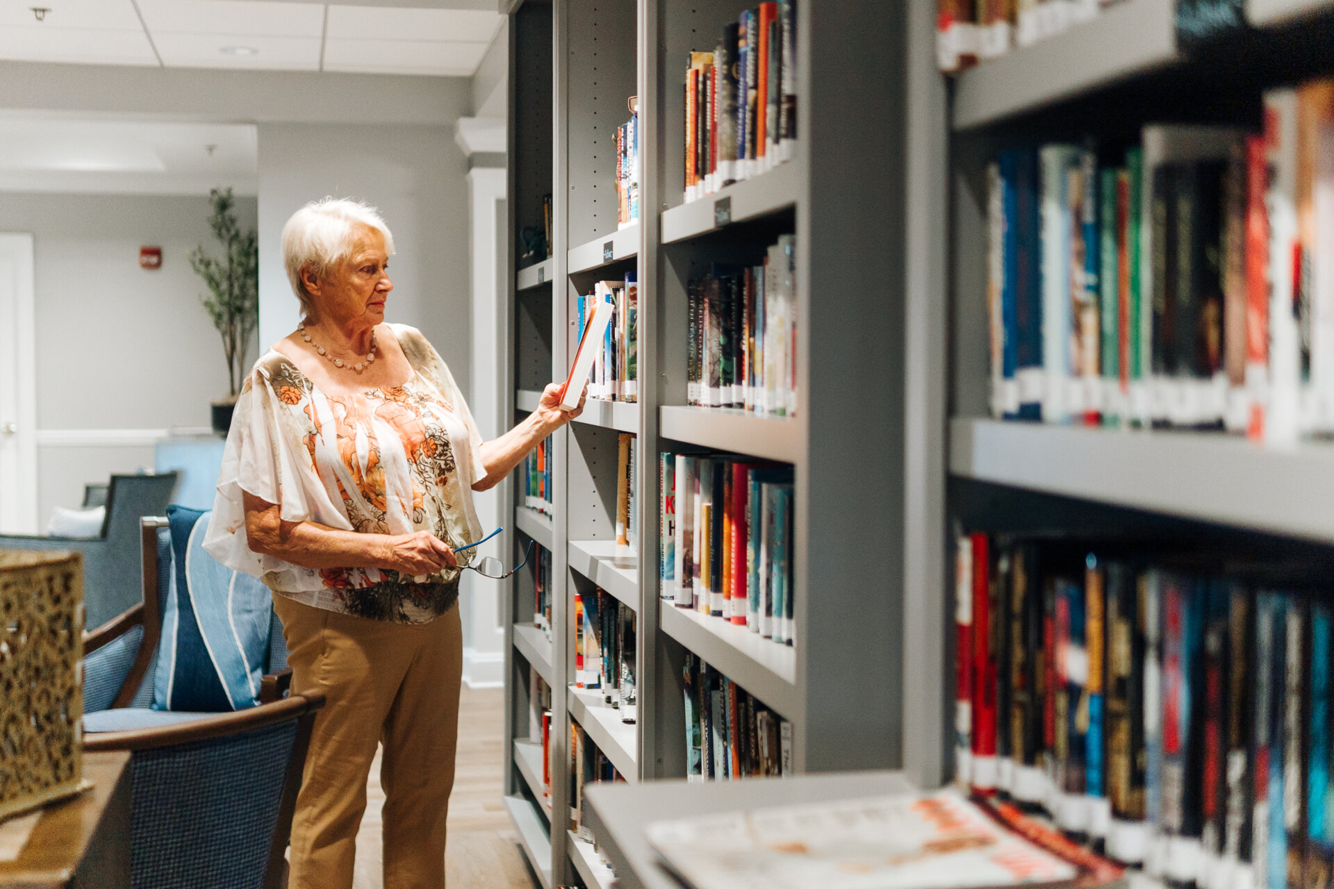 Senior woman browsing library