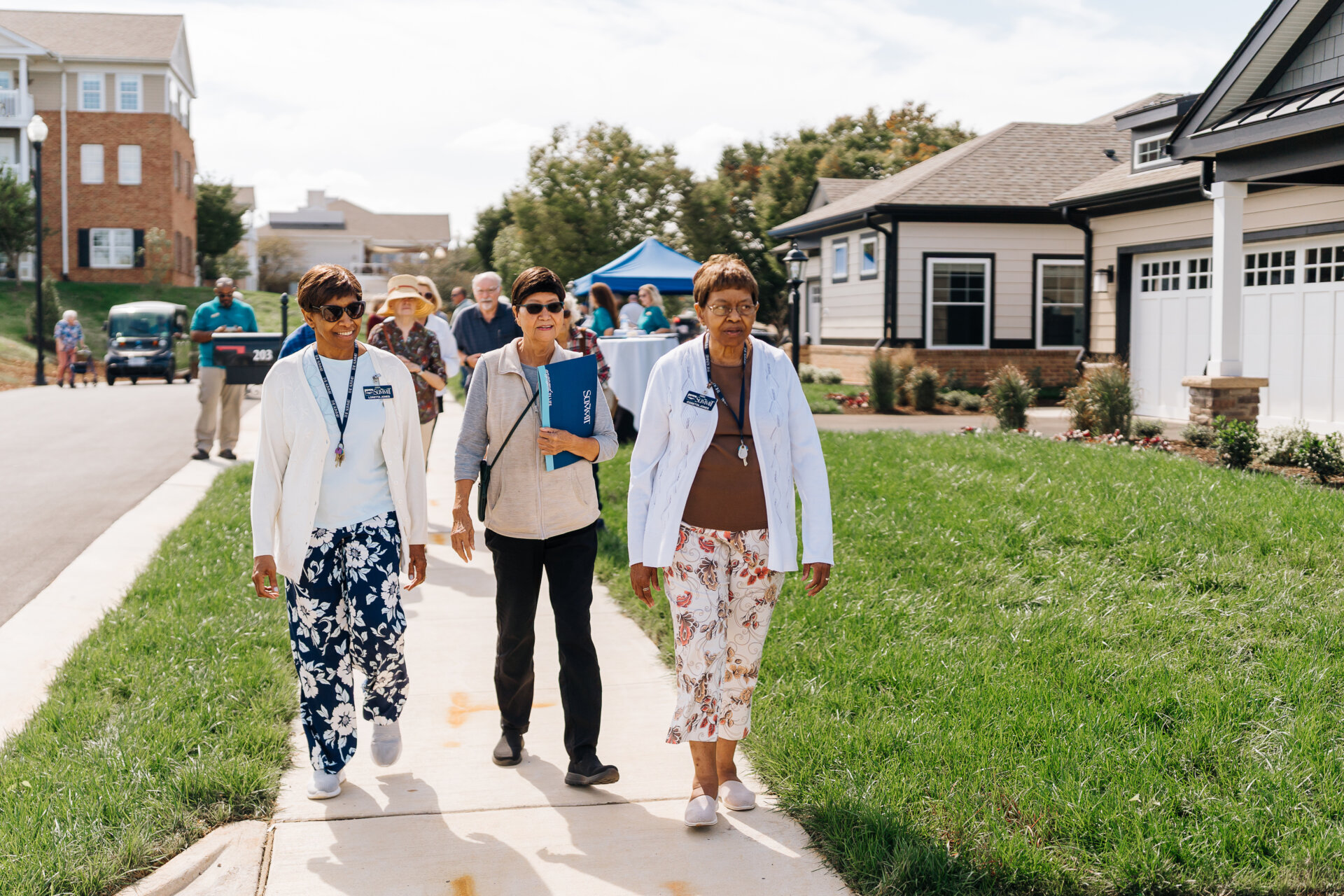 Residents walking on the sidewalks around the community